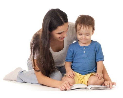 Mother and son reading book together isolated on white